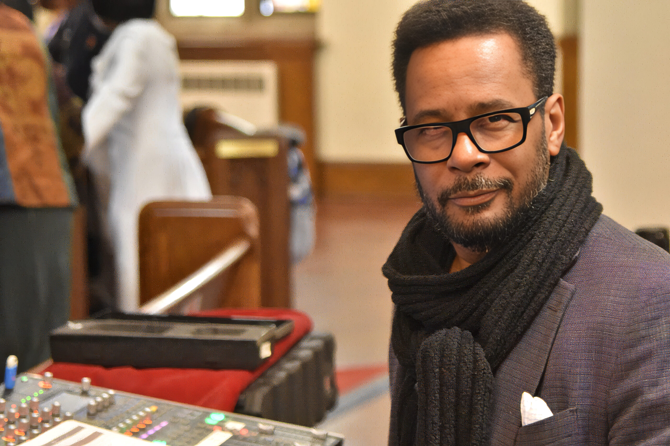 Christopher X. Walker at a mixing console during a live event
