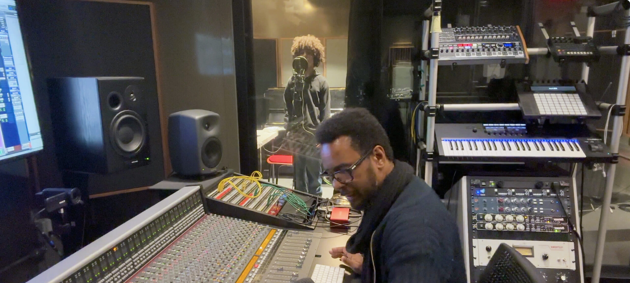 Christopher X. Walker at the console with Justice X. Walker in the vocal booth